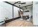 Enclosed patio with ceiling fans, comfortable seating, and a unique textured wall design at 6005 N Beach Rd # 16, Englewood, FL 34223