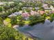 Overhead view of the home with a pool, backing onto a serene pond, showcasing the property's desirable location at 6610 Rosy Barb Ct, Lakewood Ranch, FL 34202
