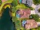 Birds-eye view of home with pool, near a tranquil pond, highlighting the home's desirable location at 6610 Rosy Barb Ct, Lakewood Ranch, FL 34202