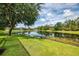Scenic backyard with lake views and well-manicured lawn at 6610 Rosy Barb Ct, Lakewood Ranch, FL 34202