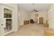 Neutral bedroom with door to lanai, ceiling fan and wicker furniture at 6610 Rosy Barb Ct, Lakewood Ranch, FL 34202