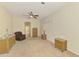 Spacious bedroom with ceiling fan, neutral walls, and wicker furnishings at 6610 Rosy Barb Ct, Lakewood Ranch, FL 34202