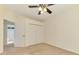 Bedroom featuring neutral walls, carpet, and an ensuite bathroom at 6610 Rosy Barb Ct, Lakewood Ranch, FL 34202