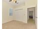 Guest bedroom with closet and doorway to office at 6610 Rosy Barb Ct, Lakewood Ranch, FL 34202