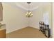 Dining room with hardwood floors, modern chandelier, wine rack, and natural light at 6610 Rosy Barb Ct, Lakewood Ranch, FL 34202