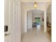 Inviting foyer with tile flooring, arched doorways, and a glimpse into the sunlit living spaces at 6610 Rosy Barb Ct, Lakewood Ranch, FL 34202