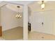 Foyer with a view into the dining room and front door, complemented by tile and wood flooring at 6610 Rosy Barb Ct, Lakewood Ranch, FL 34202