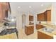 Spacious kitchen features stainless steel appliances, granite countertops, and a kitchen island at 6610 Rosy Barb Ct, Lakewood Ranch, FL 34202