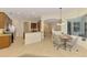 Open-concept kitchen with stainless steel appliances, granite countertops, and eat-in dining area at 6610 Rosy Barb Ct, Lakewood Ranch, FL 34202