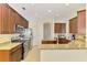 Well-equipped kitchen featuring stainless steel appliances, granite countertops, and tiled backsplash at 6610 Rosy Barb Ct, Lakewood Ranch, FL 34202