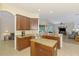 Modern kitchen with an island, granite counters, stainless appliances and an open-concept layout at 6610 Rosy Barb Ct, Lakewood Ranch, FL 34202