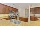 Modern kitchen with granite countertops, stainless steel appliances, and ample cabinet space at 6610 Rosy Barb Ct, Lakewood Ranch, FL 34202