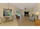 Open-concept living area with tile floors, comfortable seating, and pool view at 6610 Rosy Barb Ct, Lakewood Ranch, FL 34202
