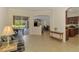 Bright living room with tile floors, open floor plan, sliding glass doors to outdoor space at 6610 Rosy Barb Ct, Lakewood Ranch, FL 34202