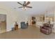 Inviting living room boasts an open floor plan and a view of the kitchen with stainless steel appliances at 6610 Rosy Barb Ct, Lakewood Ranch, FL 34202