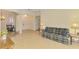 Spacious living room features tile floors, neutral walls, and comfortable, stylish furniture at 6610 Rosy Barb Ct, Lakewood Ranch, FL 34202