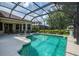 Inviting screened-in pool and spa with a tranquil fountain feature, offering a refreshing outdoor oasis at 6610 Rosy Barb Ct, Lakewood Ranch, FL 34202