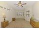 Bright sitting area with bay window, plantation shutters, and wicker furniture at 6610 Rosy Barb Ct, Lakewood Ranch, FL 34202