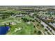 Expansive golf course community with lush greenery, scenic lakes, and beautiful homes at 7634 Windy Hill Cv, Bradenton, FL 34202