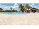 Resort-style community pool with splash fountain and lounge area for Gathering fun at 7634 Windy Hill Cv, Bradenton, FL 34202