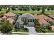 Stunning two-story home with well-manicured landscaping, tile roof and beautiful water view at 7634 Windy Hill Cv, Bradenton, FL 34202