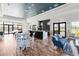 Inviting lounge area with seating, bar, and views of the pool at 7634 Windy Hill Cv, Bradenton, FL 34202