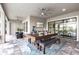 Alfresco dining area featuring a large table and comfortable seating, ideal for gatherings at 7634 Windy Hill Cv, Bradenton, FL 34202