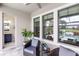 Cozy outdoor patio with comfortable seating and scenic views of the pool and golf course at 7634 Windy Hill Cv, Bradenton, FL 34202