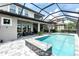 Gorgeous pool and spa with a screened-in enclosure, offering privacy and relaxation at 7634 Windy Hill Cv, Bradenton, FL 34202