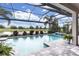 Sparkling pool with a tranquil view of the golf course and beautiful landscaping at 7634 Windy Hill Cv, Bradenton, FL 34202