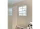 Shower features tiled walls, glass partition, and large window for natural light at 803 Montrose Dr # 201, Venice, FL 34293