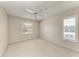 Inviting bedroom with neutral walls, plantation shutters, and carpet flooring at 803 Montrose Dr # 201, Venice, FL 34293
