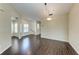 Dining room with hardwood floors and an open floor plan at 803 Montrose Dr # 201, Venice, FL 34293