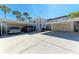 Exterior featuring covered parking and unit access at 803 Montrose Dr # 201, Venice, FL 34293
