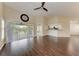 Open-concept living room with wood floors and access to the lanai at 803 Montrose Dr # 201, Venice, FL 34293