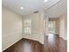 Bright living room showcasing a window with natural light and hardwood flooring at 803 Montrose Dr # 201, Venice, FL 34293