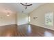 Spacious living room featuring vaulted ceilings, a ceiling fan, and hardwood floors at 803 Montrose Dr # 201, Venice, FL 34293