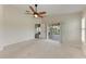 Main bedroom boasts sliding doors to a screened lanai, neutral walls and carpets and ensuite bathroom at 803 Montrose Dr # 201, Venice, FL 34293