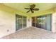 Enjoy great views from this screened patio, which has a ceiling fan and patterned flooring at 803 Montrose Dr # 201, Venice, FL 34293