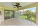 Enjoy great views from this screened patio, which has a ceiling fan and patterned flooring at 803 Montrose Dr # 201, Venice, FL 34293