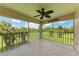 Enjoy great views from this screened patio, which has a ceiling fan and patterned flooring at 803 Montrose Dr # 201, Venice, FL 34293