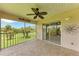 Enjoy great views from this screened patio, which has a ceiling fan and patterned flooring at 803 Montrose Dr # 201, Venice, FL 34293