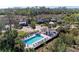Inviting community pool and pavilion surrounded by lush landscaping and comfortable lounge chairs at 803 Montrose Dr # 201, Venice, FL 34293