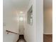 Interior stairwell with wooden handrail and decorative window at 803 Montrose Dr # 201, Venice, FL 34293