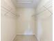 Walk-in closet is ready to be organized and features shelving for clothing and shoes at 803 Montrose Dr # 201, Venice, FL 34293