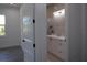 This bathroom offers a vanity with drawers and a mirror that adds space to the room at 8045 Bosco Rd, Port Charlotte, FL 33981