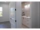 Elegant bathroom featuring granite countertops, stylish vanity, and natural light through a window at 8045 Bosco Rd, Port Charlotte, FL 33981