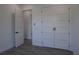 Bedroom featuring stylish closet doors, a door, and wood floors at 8045 Bosco Rd, Port Charlotte, FL 33981
