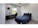 Bedroom with black-and-white accents, a dark-wood desk, and a window with a view at 8045 Bosco Rd, Port Charlotte, FL 33981