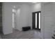 Foyer with light wood floors, white walls, and modern doors creating a welcoming entrance at 8045 Bosco Rd, Port Charlotte, FL 33981